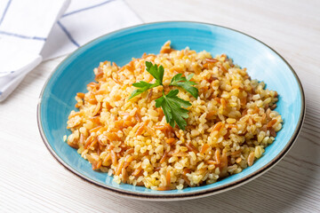 Traditional delicious Turkish food, bulgur pilaf with vermicelli (Turkish name; arpa sehriyeli bulgur pilavi)