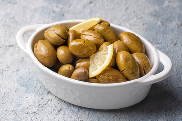 Cracked green olives. Cracked green olives with lemon. Turkish style olive (Turkish name; kirma zeytin)