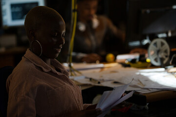 Portrait of confident businesswoman sitting at desk