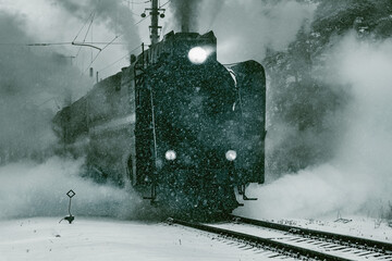 Steam retro train departs from the station.