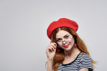 Fototapeta premium beautiful woman wearing a red hat makeup France Europe fashion posing lifestyle