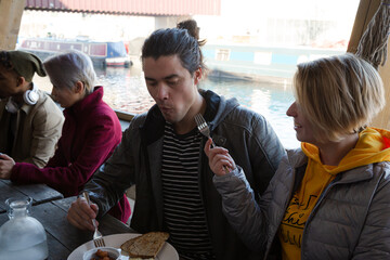 Couple sharing breakfast at restaurant outdoor patio