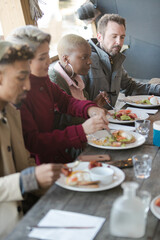 Friends dining together outdoors