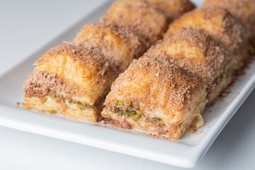 Traditional turkish new dessert cold milky baklava with pistachio (Turkish name; soguk baklava)