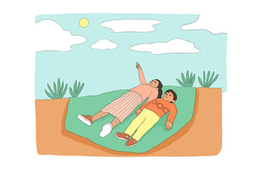 Girl and boy laying on blanket and staring up at the sky 
