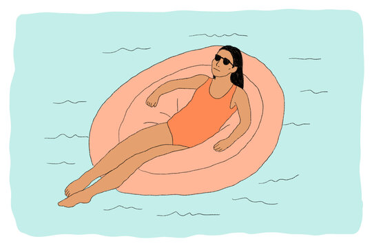Woman lounging in pool on tube