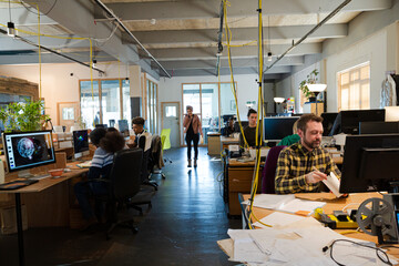 People working in open plan office