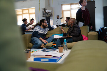 Friends working together in cosy office