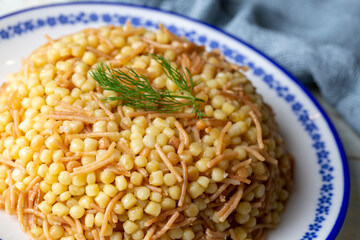 Traditional delicious Turkish food; Couscous pilaf with vermicelli (Turkish name; Sehriyeli kuskus pilavi)