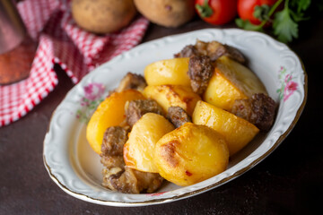 From traditional delicious Turkish food; potato and meat dish in casserole (Turkish name; Guvec tas kebabi, tandir)