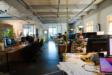 People working in open plan office