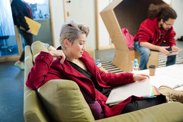 Man and woman reviewing paperwork in cosy office