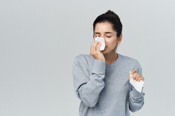 woman in sweater handkerchief cold infection discontent