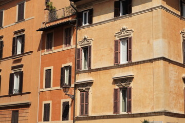 Fototapeta na wymiar Brown House Facades Close Up with Street Lantern in Rome, Italy