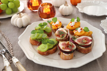 Autumn fruit canapes with figs, persimmon, white grapes and ...
