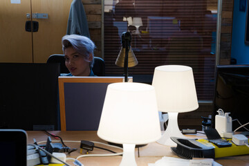 Young woman working at computer in office