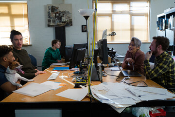 Colleagues working at computer in office