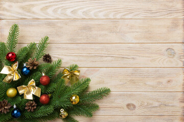 Christmas background with fir branches and Christmas decor. Top view, copy space for text