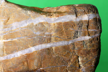 close-up natural stones on green background