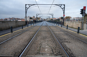 Obraz premium Porto, Portugal, October 31,2020. View on bridge and colorful old houses on hill in old part of city