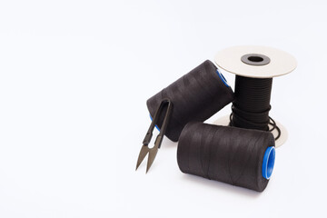 reels of thread on a white background sewing accessories