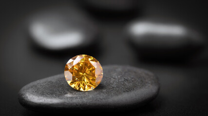beautiful of yellow gemstone round cut on stone, close up shot