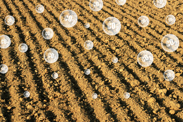 Carbon dioxide escaping from the soil into the atmosphere due to plowing.