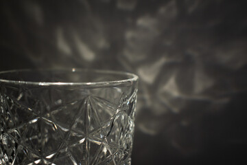 Crystal tea light candle holder detail, light reflecting from the wall  