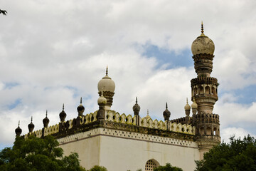 Fototapeta na wymiar Old Islamic Architectural art of Minaret at old Ruined Mosque/Masjid