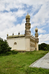 Fototapeta na wymiar Old Islamic Architectural art of Minaret at old Ruined Mosque/Masjid