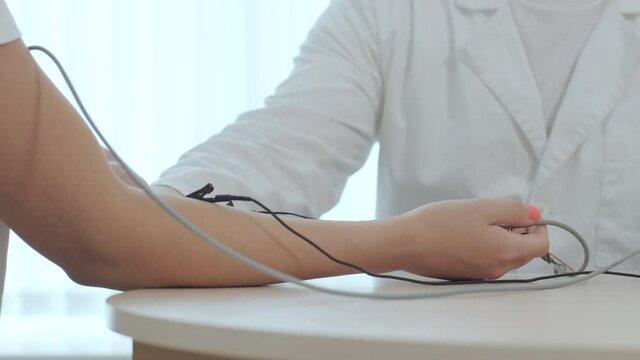 Patient nerves testing using electromyography at medical center