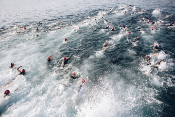 Top view shot of a swimming competition with swimmers in an ocean