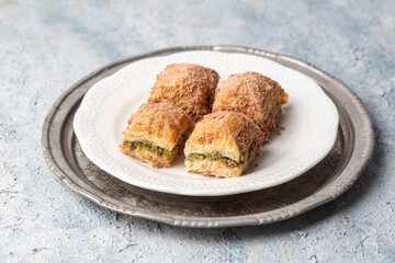 Traditional turkish new dessert cold milky baklava with pistachio (Turkish name; soguk baklava)
