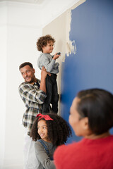 Fototapeta na wymiar Happy family painting wall