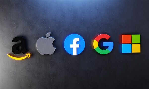 The Big Five of tech. Three-dimensional logos of Tech Giants Amazon, Apple, Facebook, Google and Microsoft against concrete wall. Editorial 3D illustration