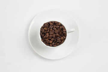 Coffee beans in white glass, white background