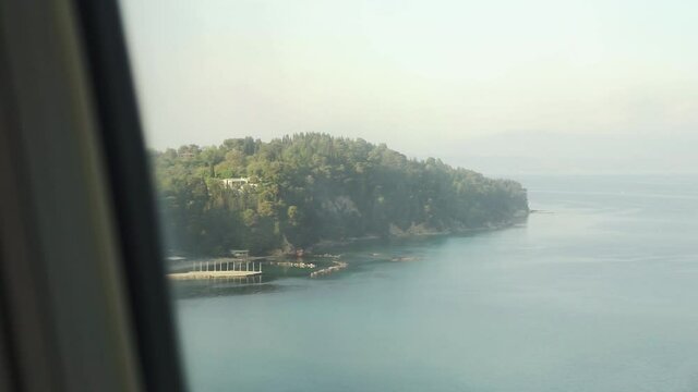 View out of an airplane window on the greek island corfu  during landing