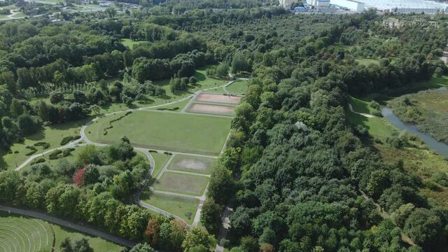Walking paths and sports grounds in the park area. Aerial photography.