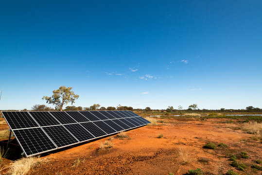 View of Solar Panels in desert desert landscape with clear blue sky