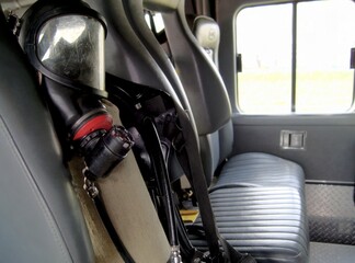 A firefighter's breathing apparatus in the cabin of a fire truck. Respiratory protection from toxic environment.