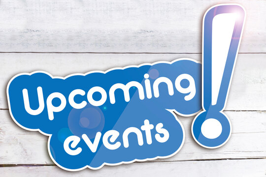 Upcoming events on wooden background 