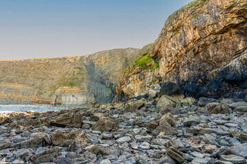 cliff rock fall onto the beach at Southerndown bridgend Wales a result of storms attributed to...