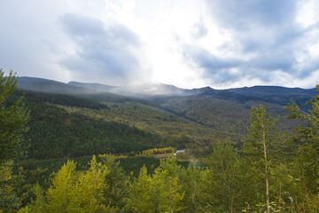 Storm clouds over mountains and valley in Glacier National Park, Montana, USA