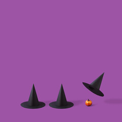 Witch hats playing gambling game to reveal shiny orange pumpkin. Funny Halloween concept.