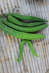 green beans on wooden background