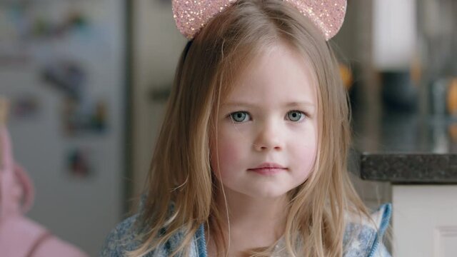 portrait beautiful little girl wearing cute cat ears having fun at home playing dress up enjoying childhood imagination