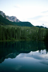 Obraz na płótnie Canvas Crystal water of Lake Carezza (Karersee) in Dolomite Alps, Trentino Alto Adige, South Tirol, Italy at daytime
