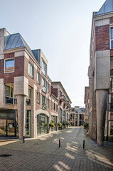 Zwolle, The Netherlands, August 4, 2021: strret with modern residential and retail building with a neo-classicist touch