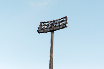 Pole with spotlights at a sports stadium.
