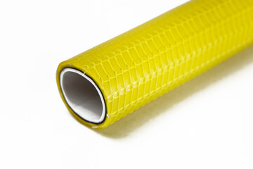 The cut tip of the rubber hose, on a white background